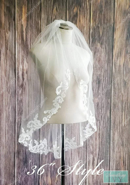 http://somethingivy.com/cdn/shop/products/baroque-lace-fingertip-wedding-veil-with-a-rolled-edge_1200x630.jpg?v=1600701799