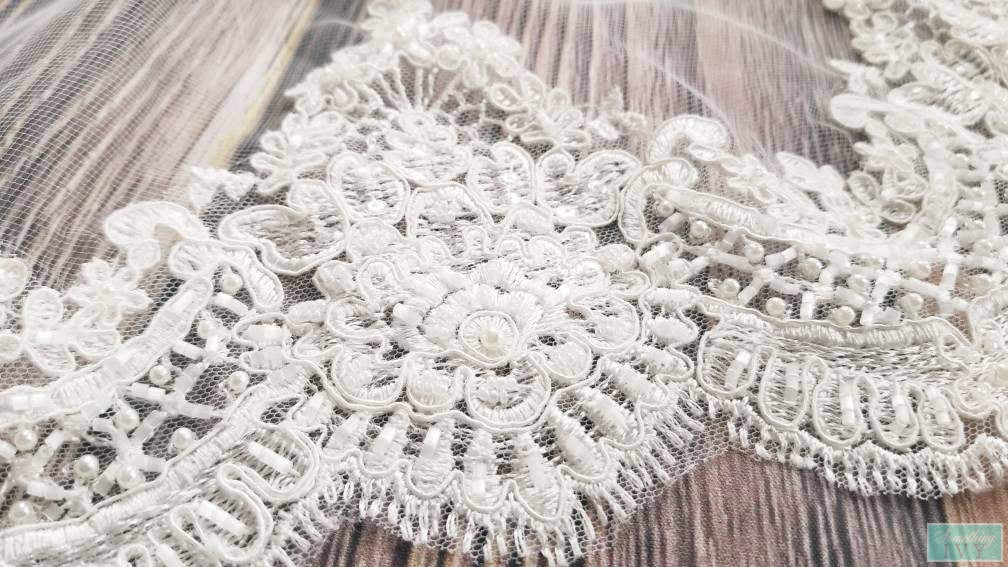 http://somethingivy.com/cdn/shop/products/fast-ship-120-heavy-beaded-cathedral-lace-wedding-veil-fringe-edge_1200x630.jpg?v=1600708990