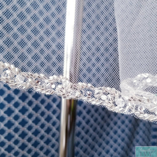 https://somethingivy.com/cdn/shop/products/38-bugle-beaded-edge-wedding-veil-wsilver-accents-wedding-veils-with-silver-beads-3_620x.jpg?v=1591500638